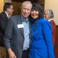 Chuck Schoenknecht and President Mantella hugging and smiling at camera